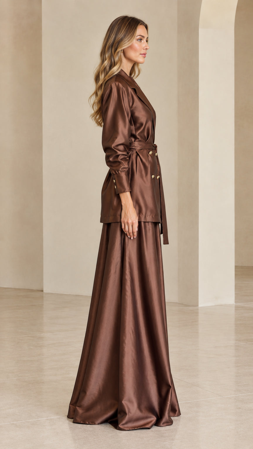 Side profile view of chocolate brown satin blazer and maxi skirt set