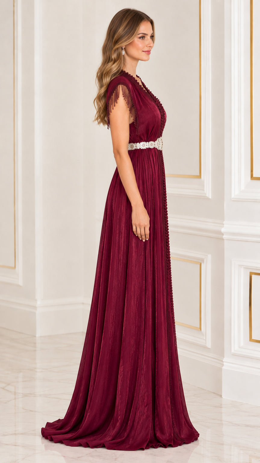 Side profile of burgundy pleated kaftan floor length evening gown