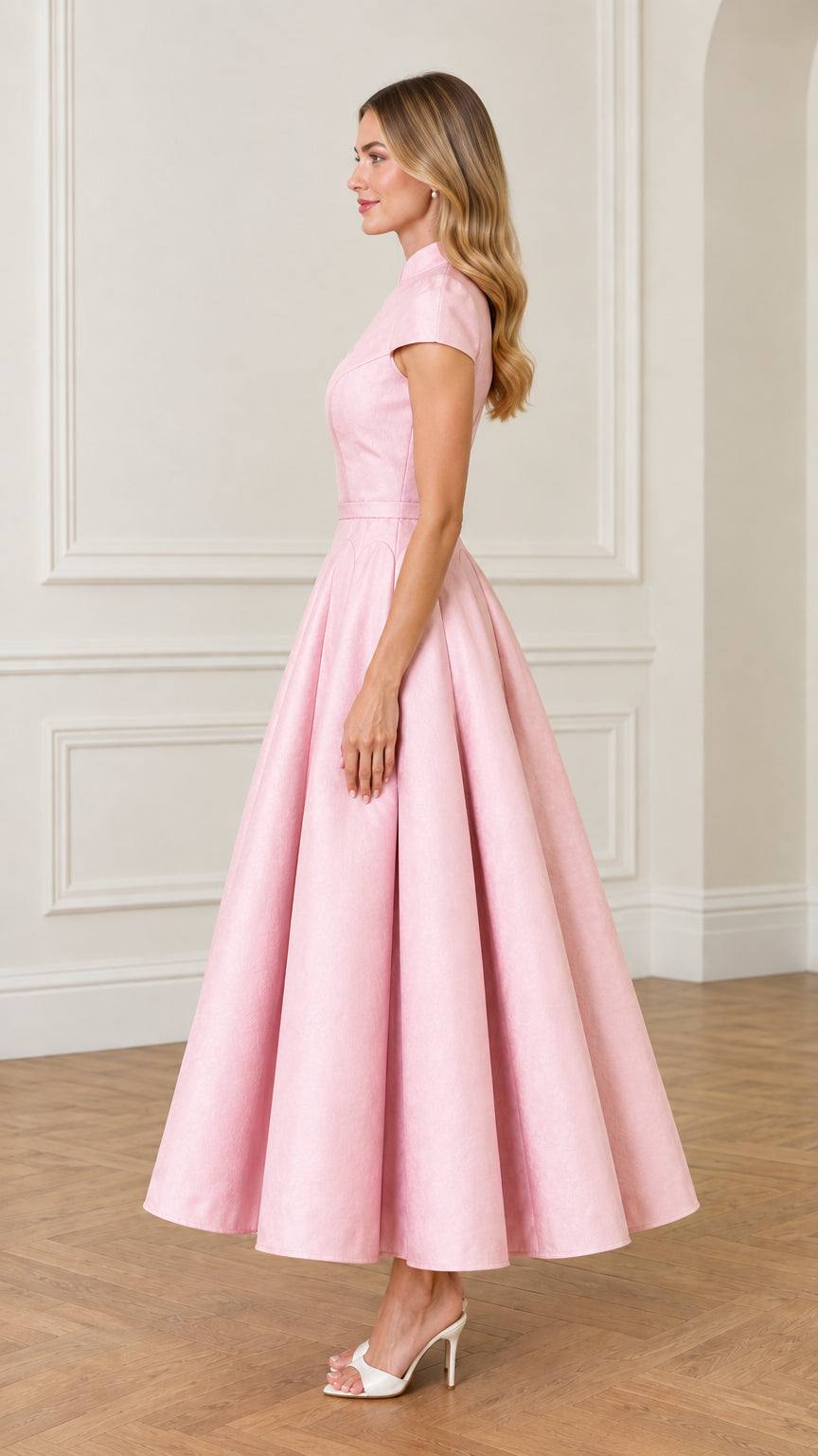 Side profile view of woman modeling Pink pleated flare maxi dress