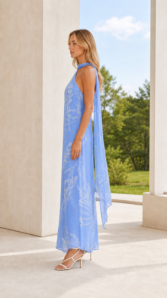 Side profile of model in light blue floral maxi dress with scarf detail