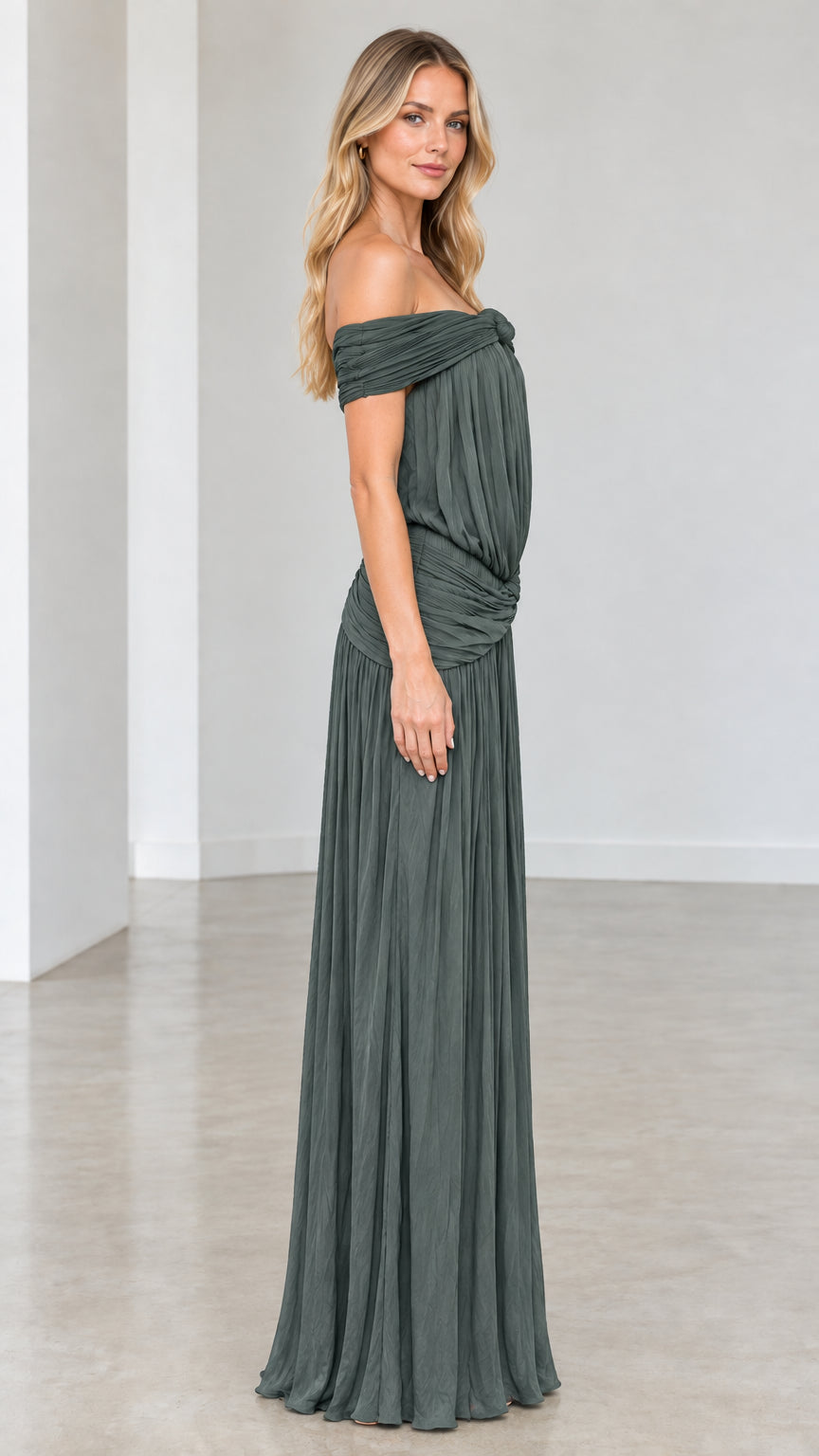 Side profile view of Sage Green pleated floor-length gown