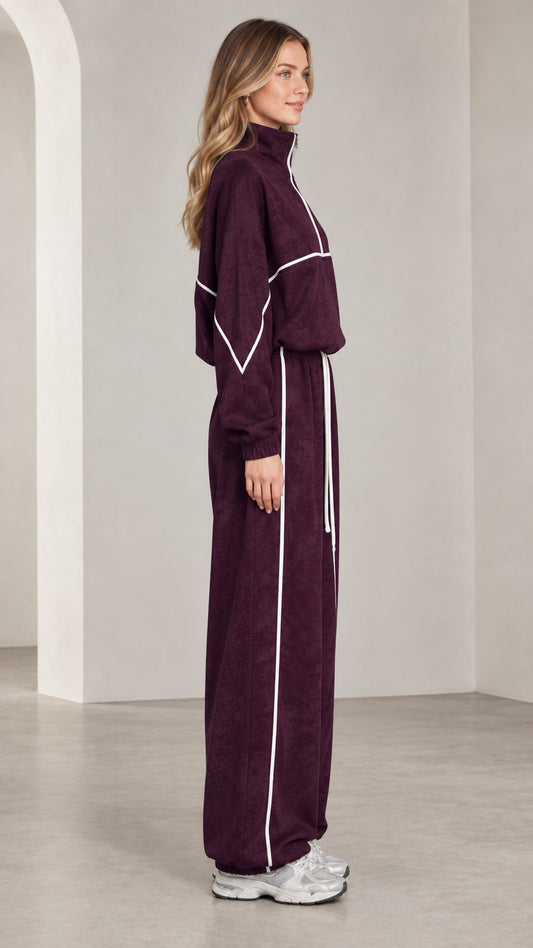 Side view of woman in burgundy 2-piece lounge tracksuit set