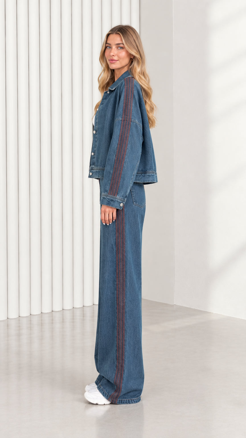 Side profile of model wearing Classic Blue two piece denim outfit