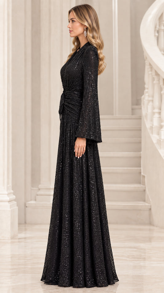 Side profile view of black sequin floor-length formal dress