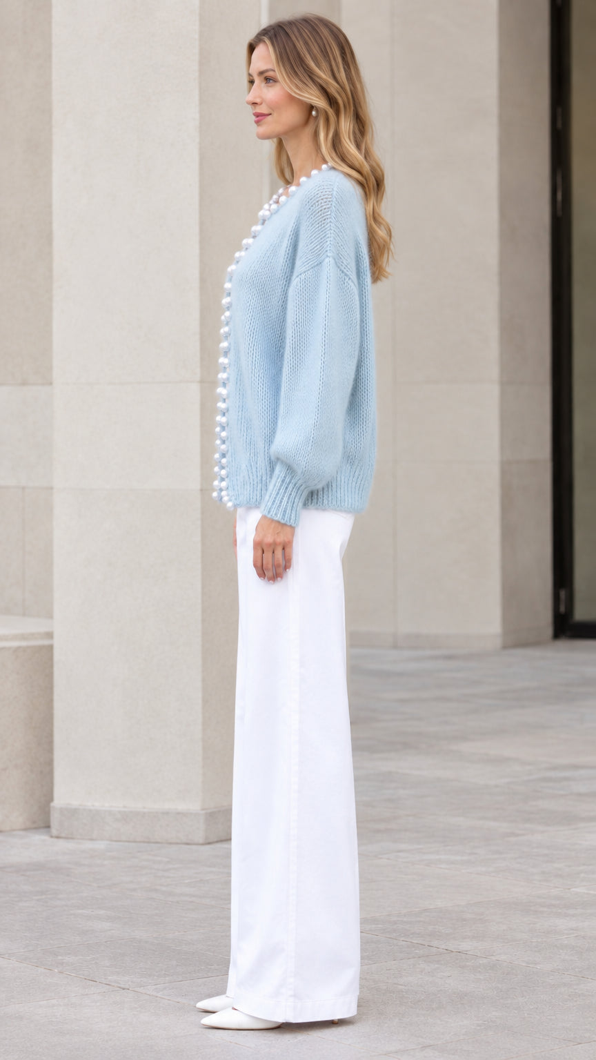 Model wearing Light Blue pearl-trimmed knit cardigan sweater side view