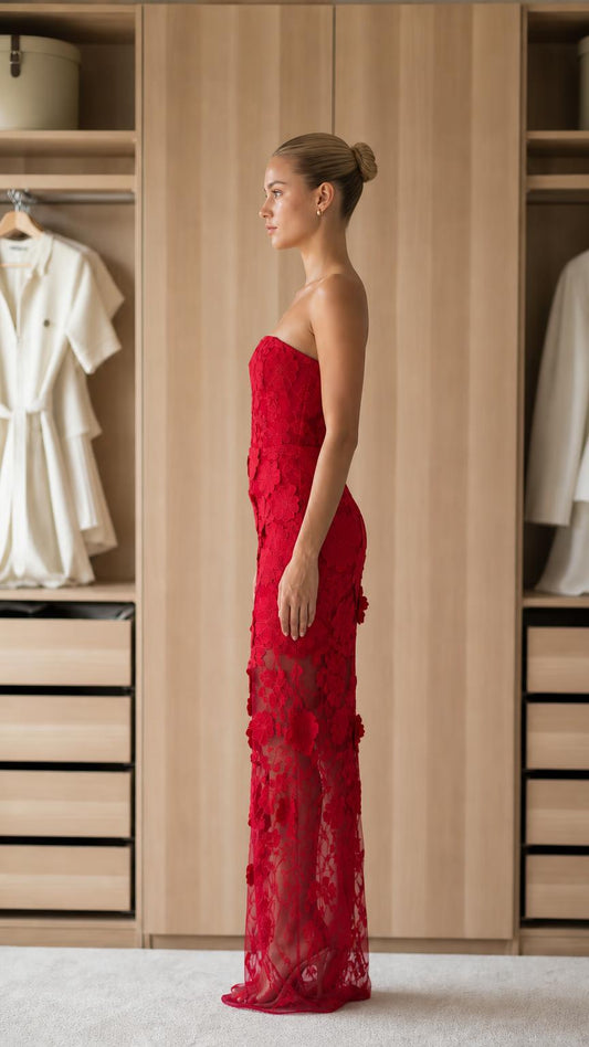 Side profile of red strapless floral applique maxi dress