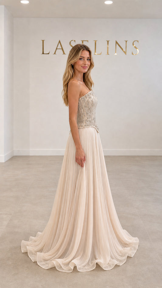 Champagne pleated evening dress with embellished corset bodice side angle view