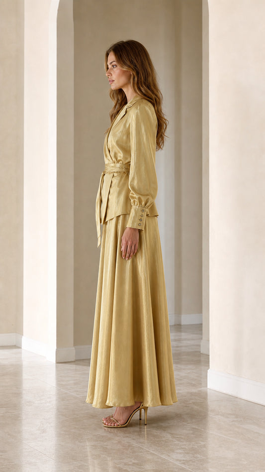 Side profile view of woman wearing Champagne Gold satin two-piece maxi set
