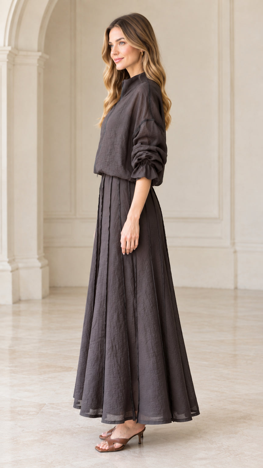 Side profile view of charcoal grey matching two-piece maxi skirt set