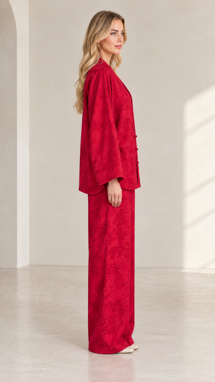 Side profile view of women's red jacquard two-piece loungewear set