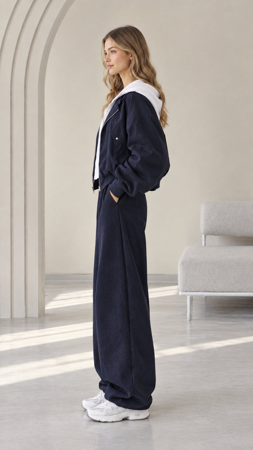 Side profile of model wearing the Navy Blue 2-piece casual loungewear tracksuit