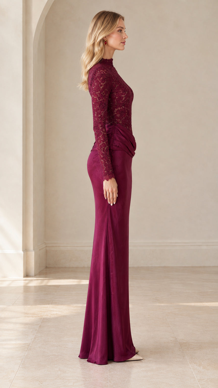 Side profile of burgundy long sleeve lace evening gown