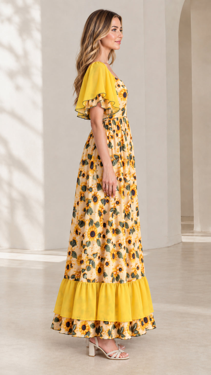 Side angle view of woman wearing yellow sunflower print maxi dress
