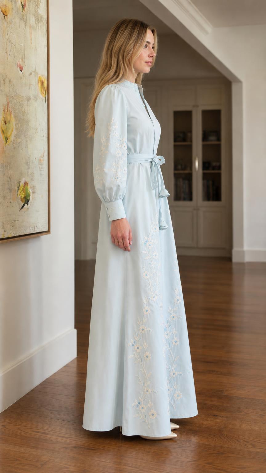 Side profile of light blue embroidered dress