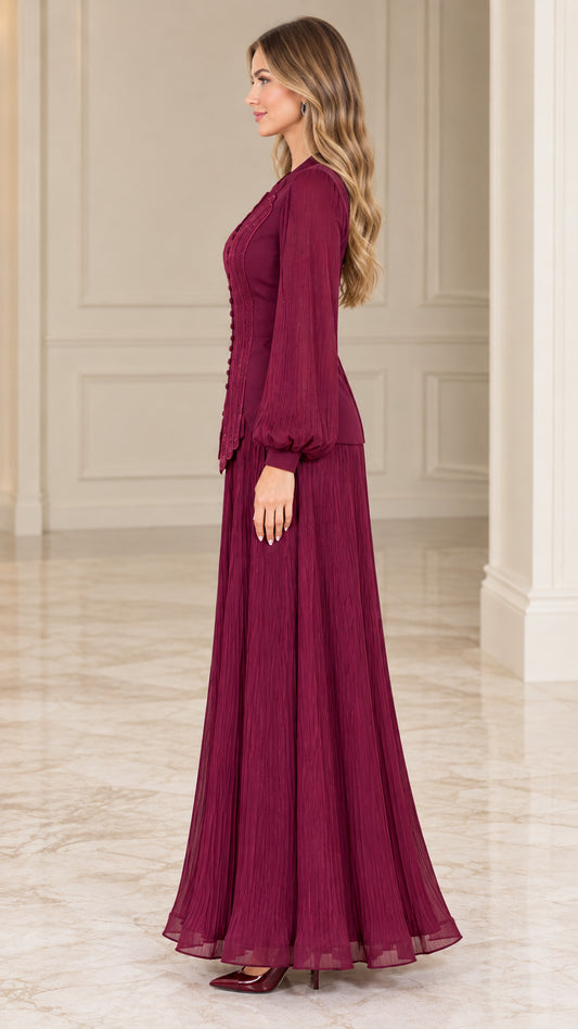 Side profile view of burgundy pleated long sleeve maxi gown