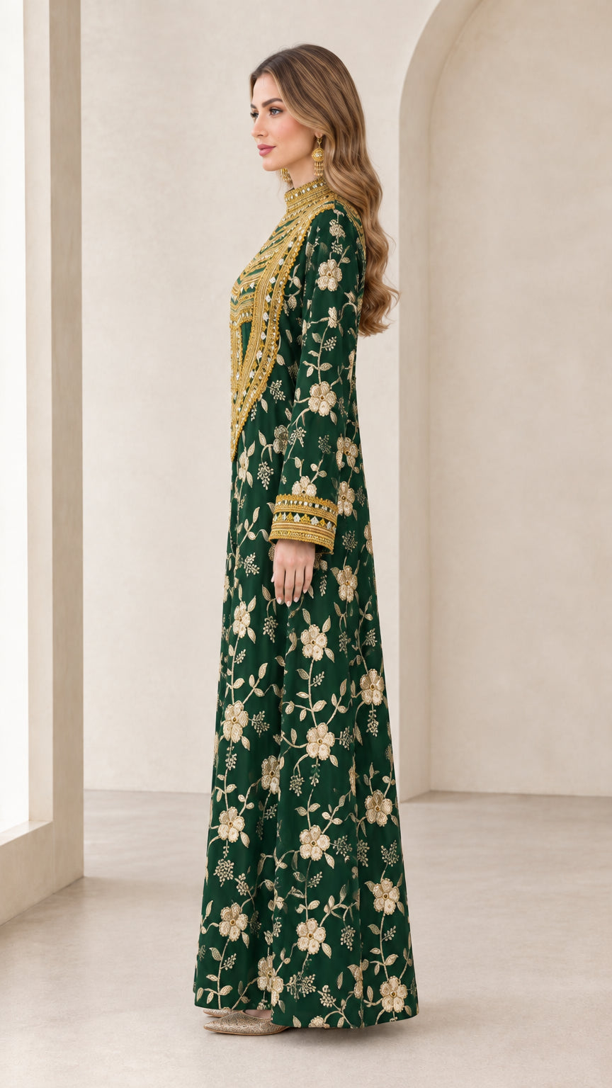 Side profile view of emerald green long sleeve floral embroidered gown