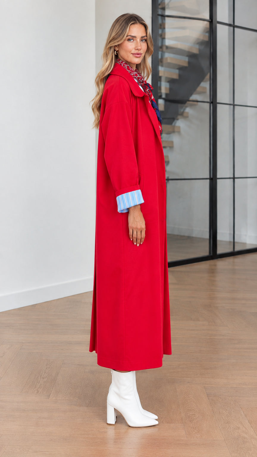 Side profile view of woman modeling the Red long duster coat
