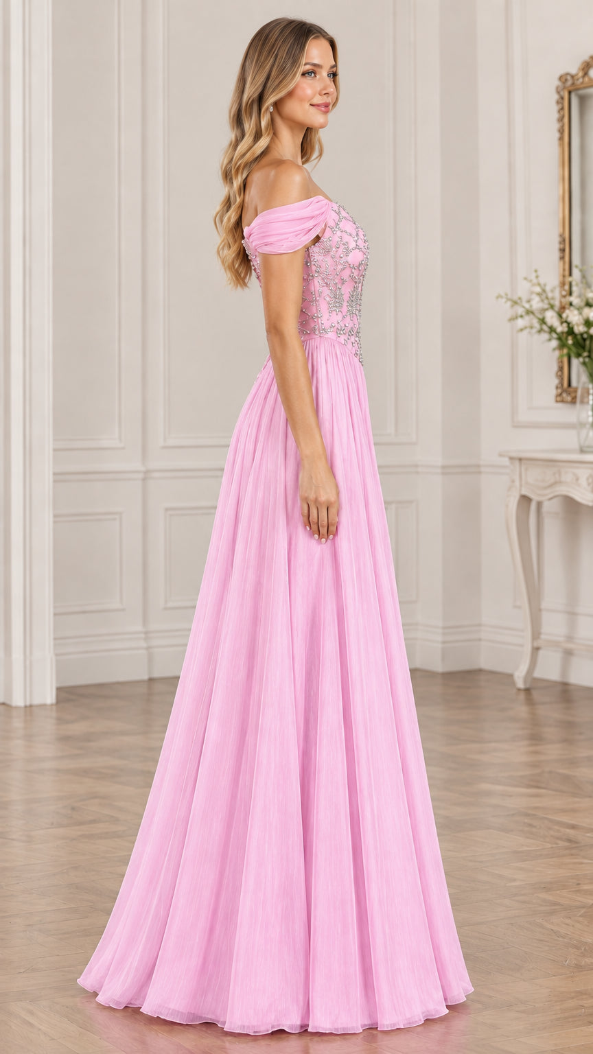 Side view of model in pink A-line tulle formal gown