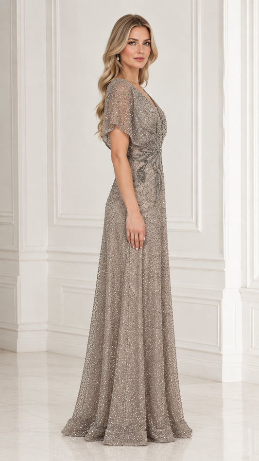 Side profile of model in taupe beaded maxi dress with flutter sleeves