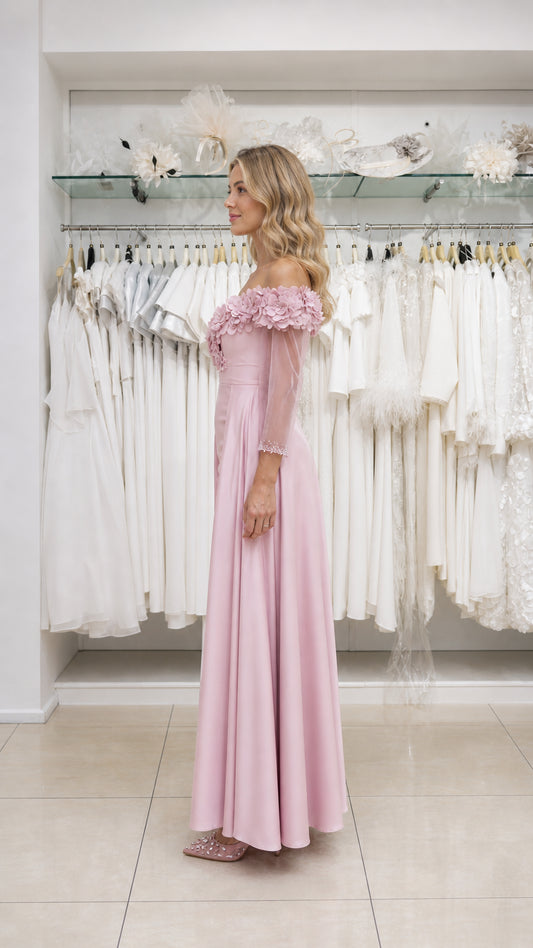 Model wearing pink evening gown, side view