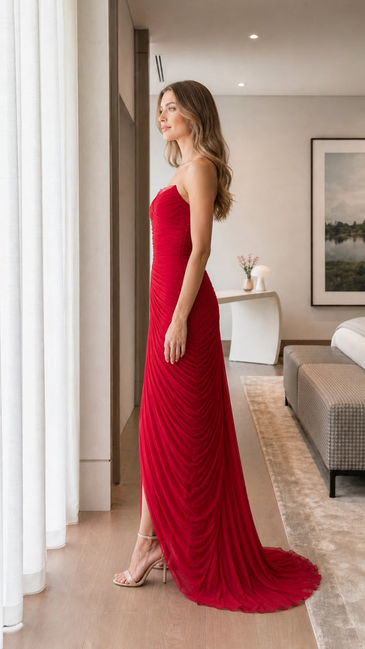 Side profile view of red evening maxi dress with court train