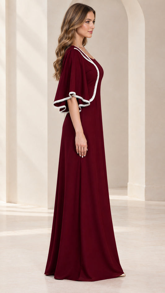 Side view of model in burgundy flutter sleeve evening gown showing elegant silhouette