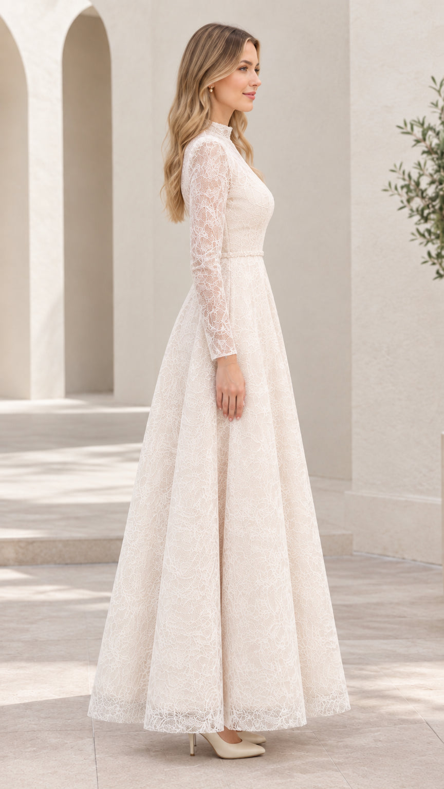 Side profile of woman in long sleeve ivory lace A-line evening gown