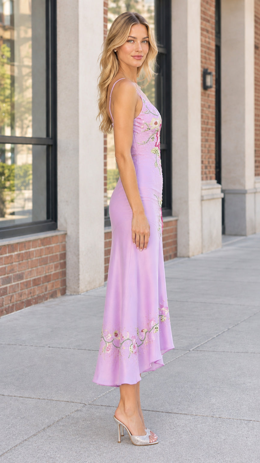 Side profile view of woman wearing lavender sequin slip midi dress with slender straps