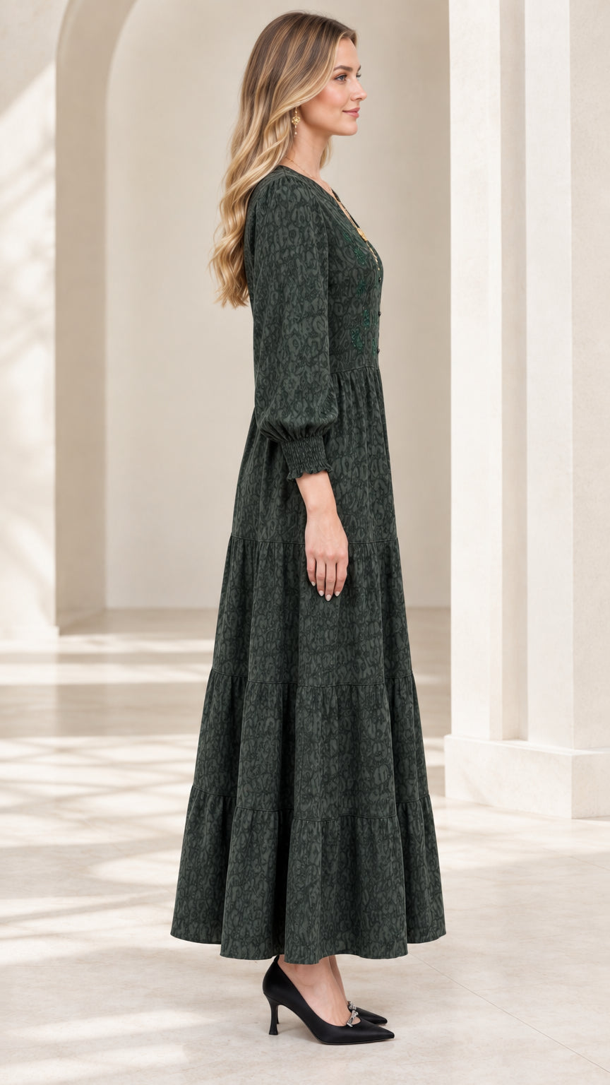 Side profile view of dark green long sleeve tiered maxi dress