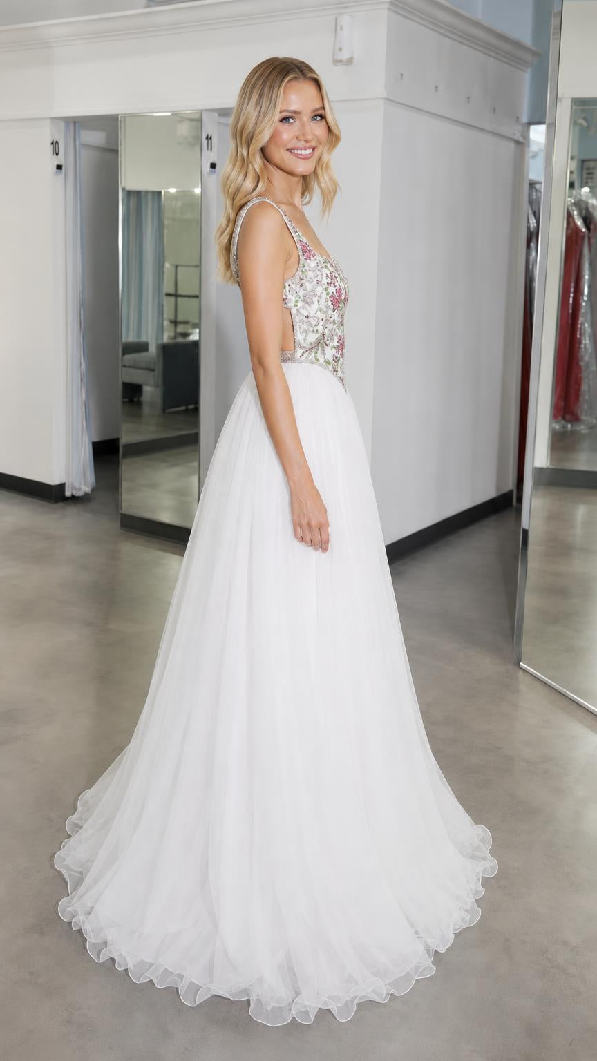 Side profile of white embroidered bodice tulle ball gown
