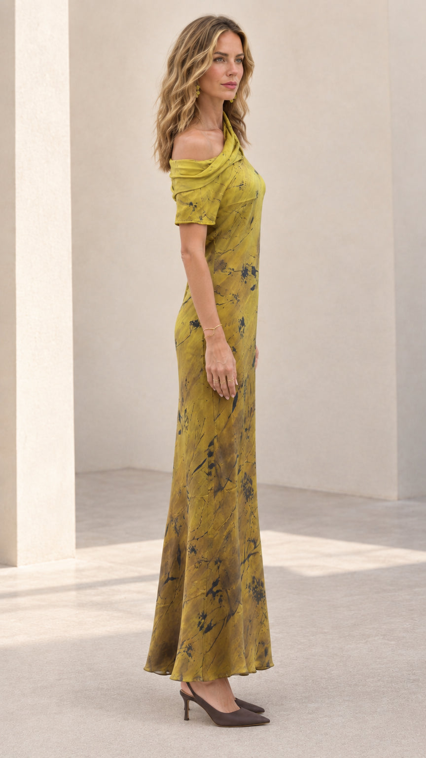Side profile view of woman modeling the olive green draped maxi dress