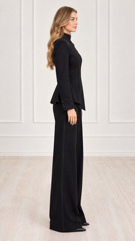 Side profile of woman wearing black tailored asymmetric pantsuit set
