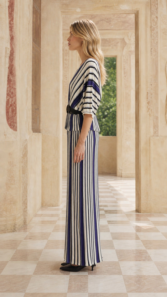 Side profile of woman in blue striped maxi set