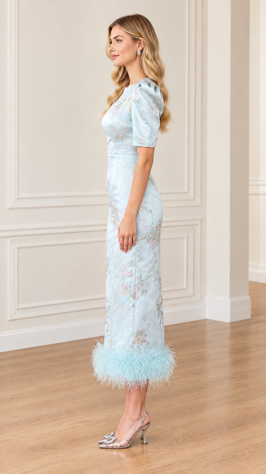 Side profile view of Light Blue jacquard sheath dress with feather trim