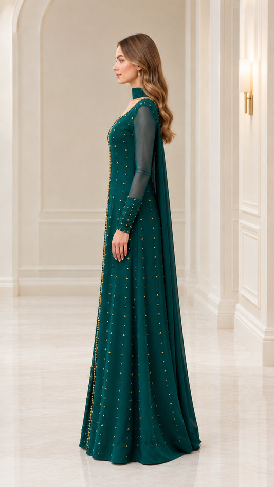 Side profile of emerald green formal maxi dress with sheer sleeves