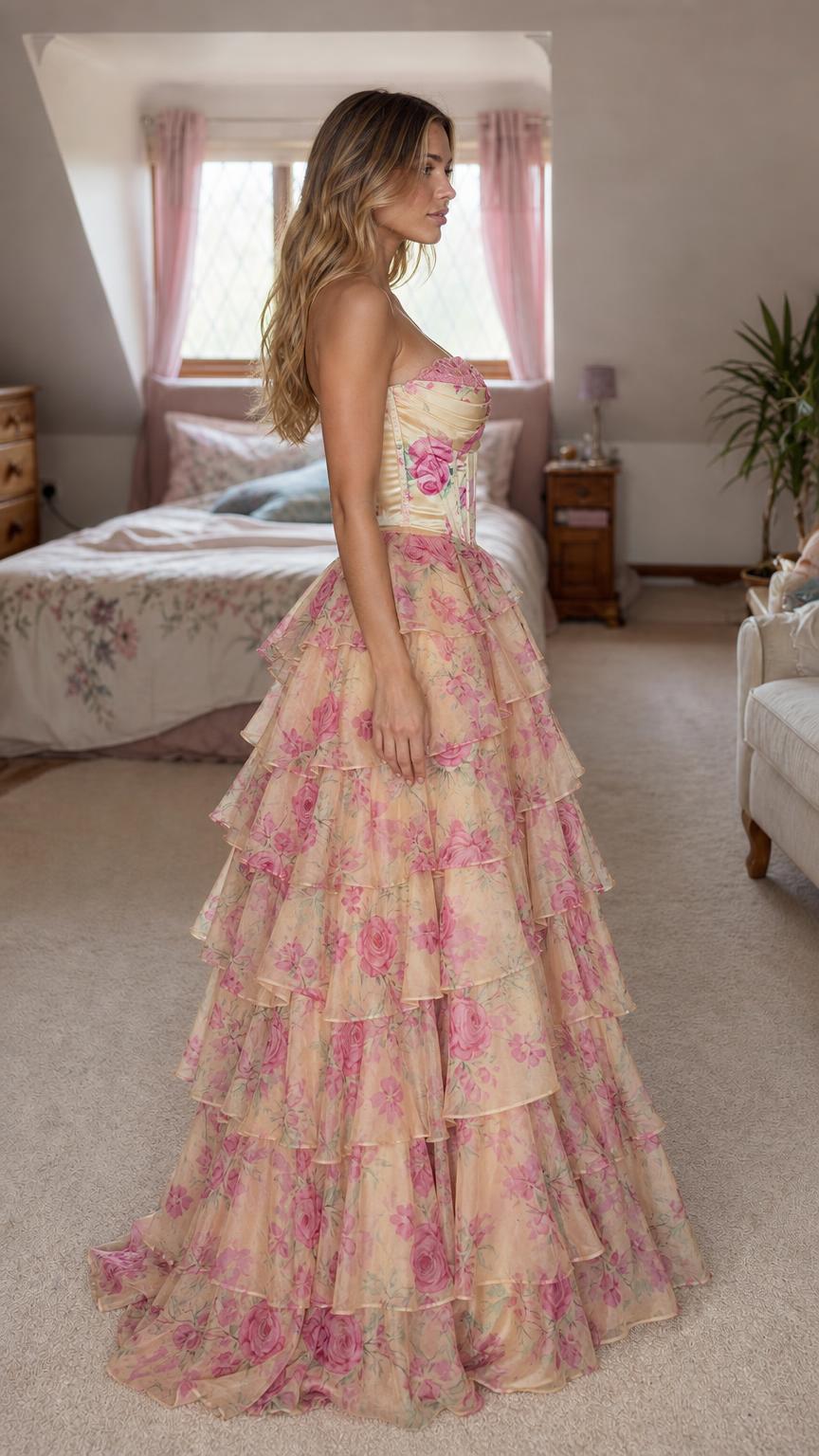 Side profile view of yellow floral tiered ruffle gown