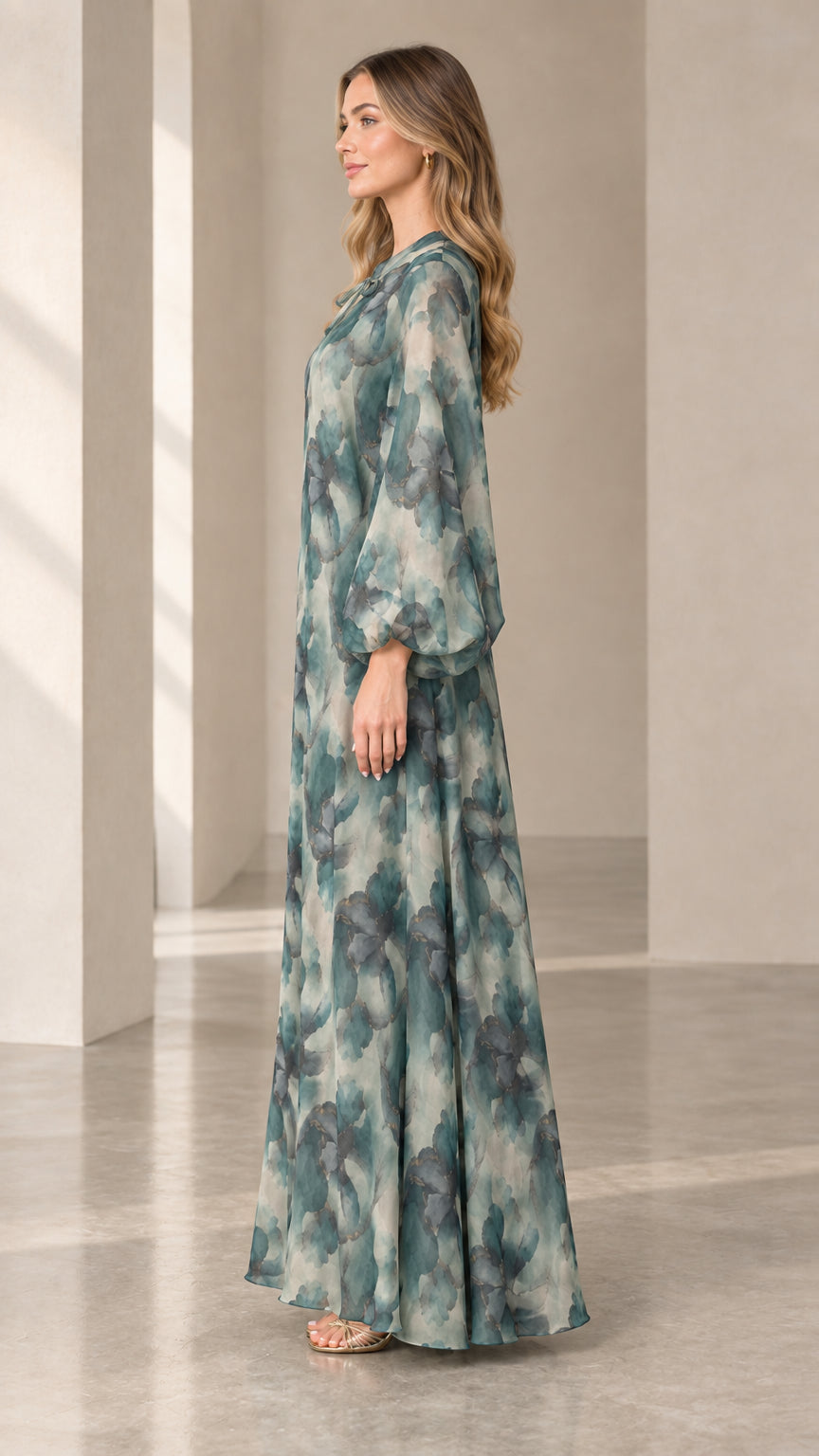 Side profile of woman in sage green floral print long sleeve maxi dress