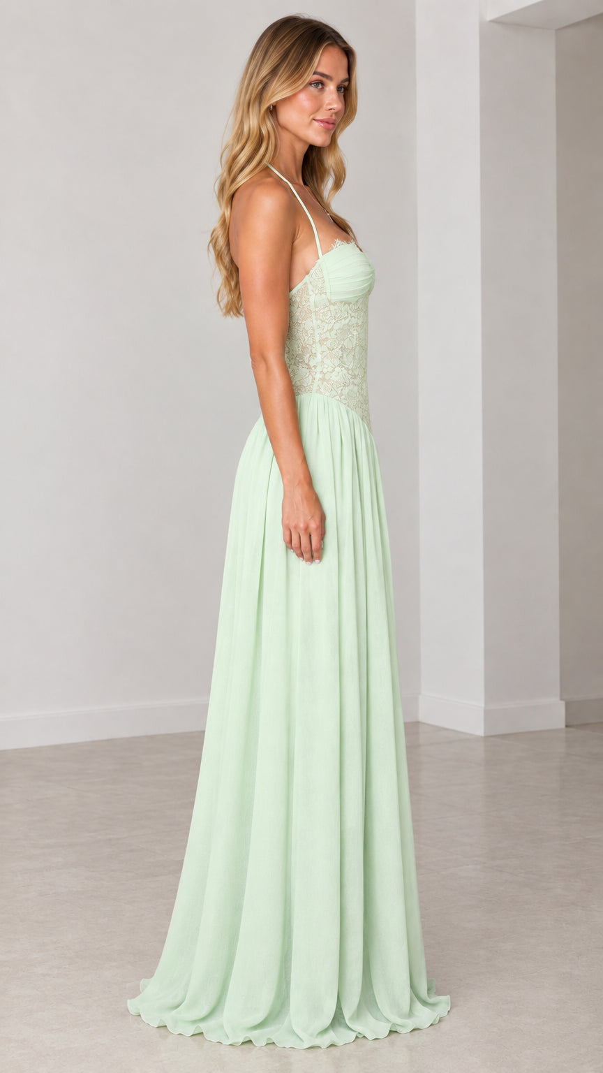Side profile of model in mint green halter neck evening gown