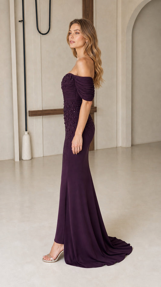 Side profile view of dark plum beaded mermaid formal evening dress