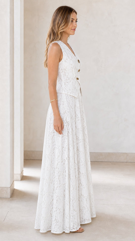 Side view of model wearing white lace vest and wide leg jumpsuit