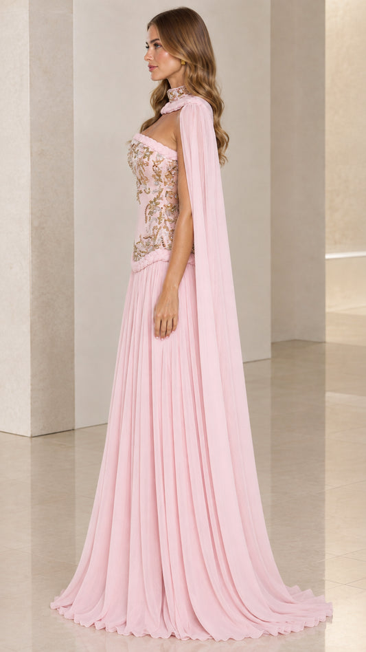 Blush pink formal cape gown side angle showing draped cape and pleated skirt