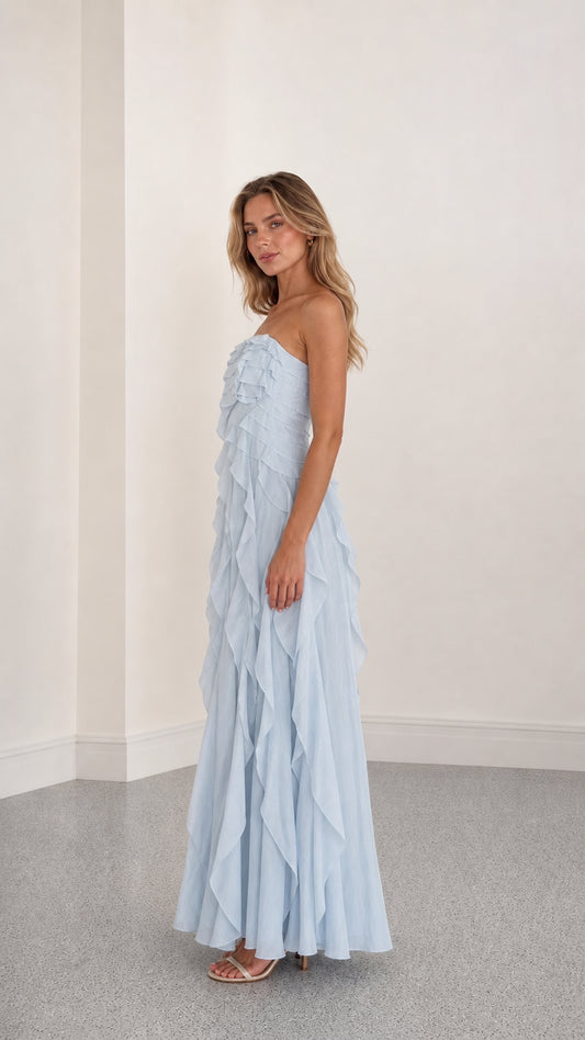 Side profile view of light blue ruffle maxi dress