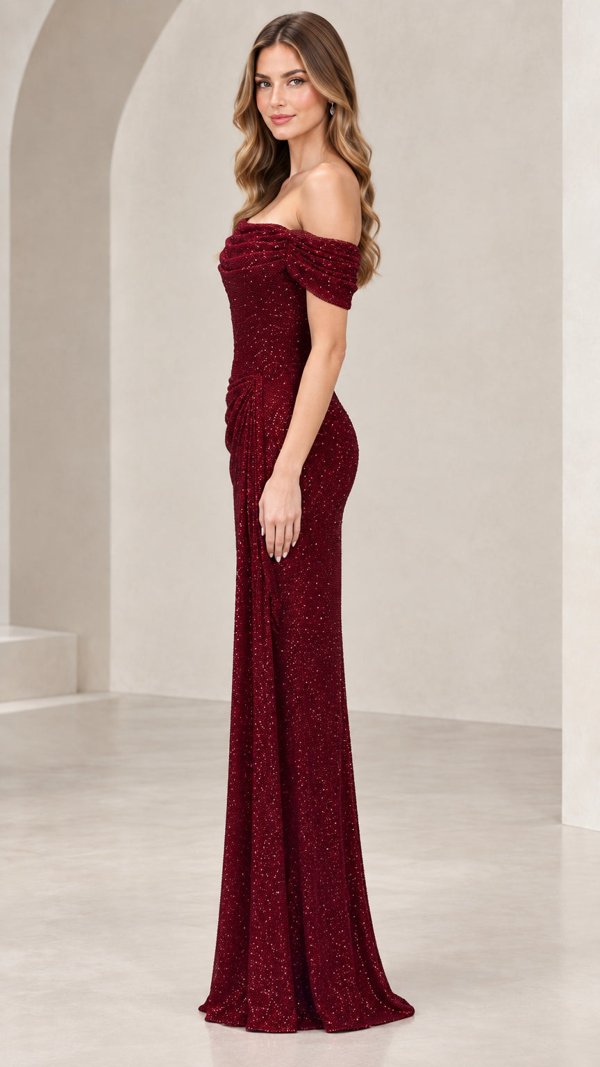 Side profile view of burgundy off-shoulder floor-length formal dress