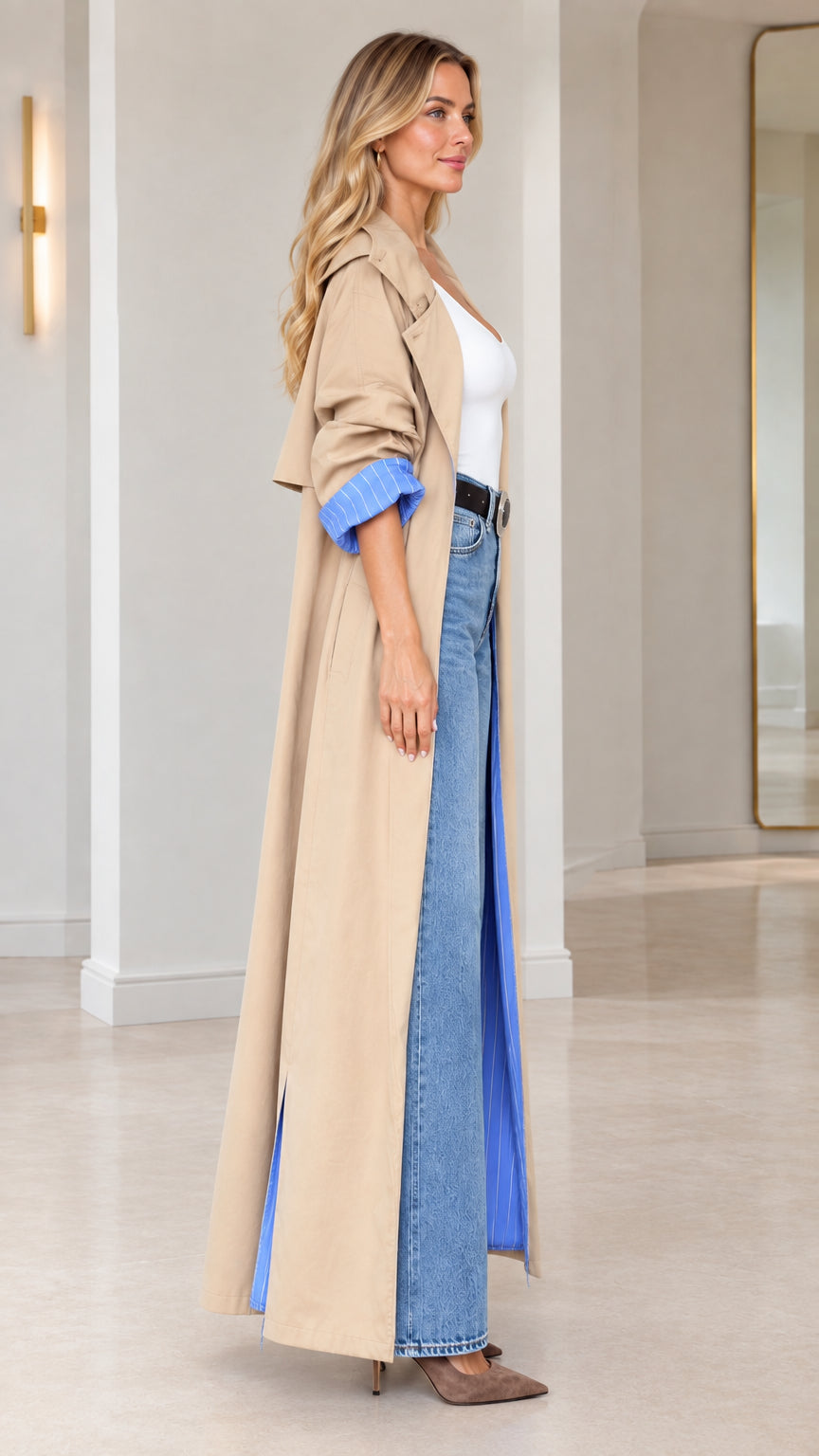 Side profile view of camel maxi trench coat showing full-length drape and blue interior lining