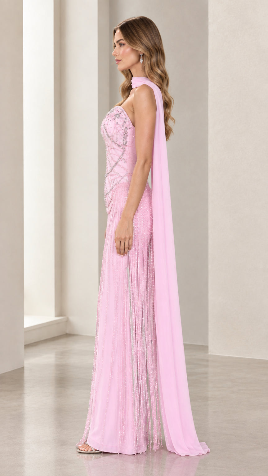 Side profile of model wearing Blush Pink embellished maxi gown with draped scarf