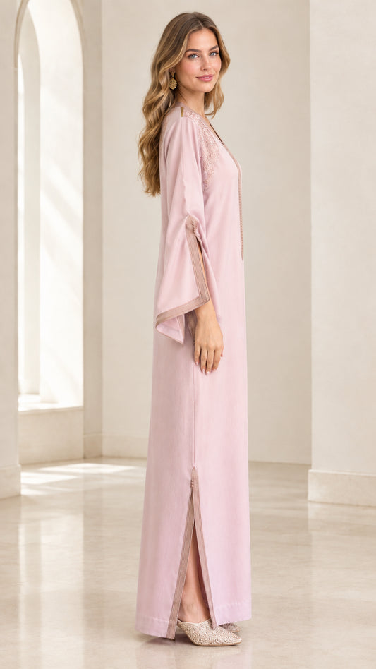 Side profile of woman wearing Dusty Pink kaftan dress highlighting sleeve slits and straight silhouette