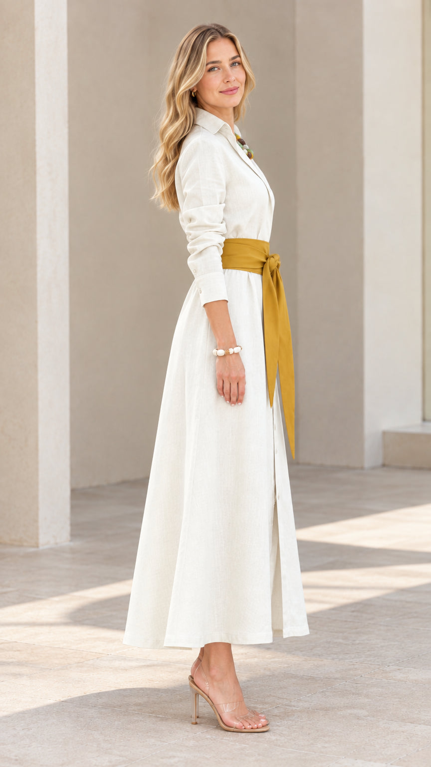 Side profile of model wearing cream collared maxi shirt dress