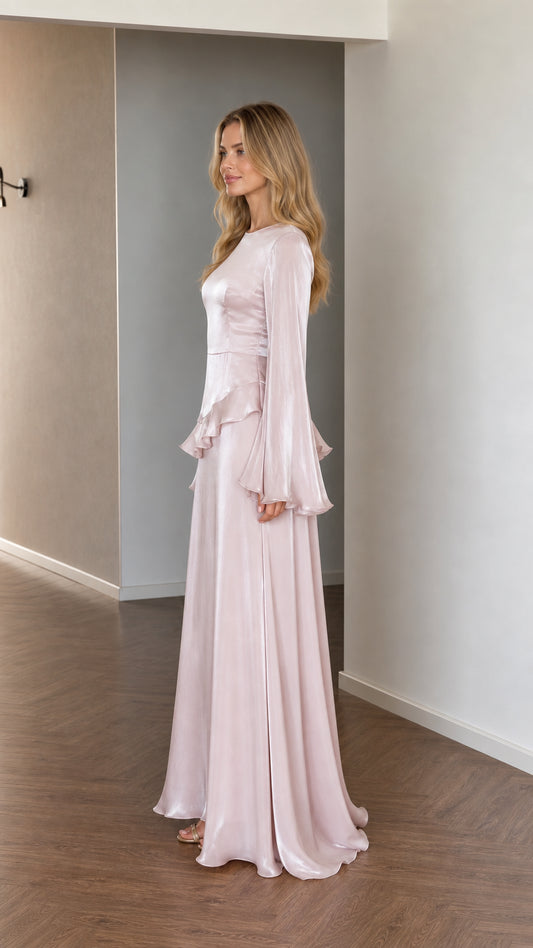 Side profile of model in pink satin maxi dress