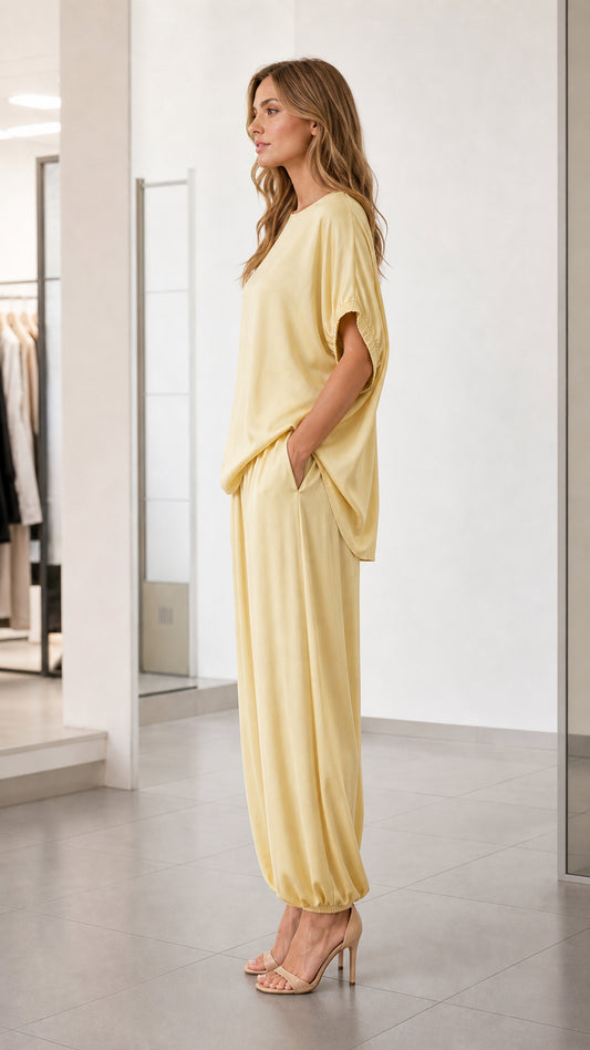 Side profile of model in yellow relaxed fit lounge set
