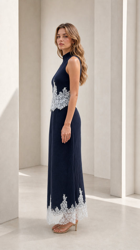 Model wearing navy mock neck lace trim maxi dress, side view